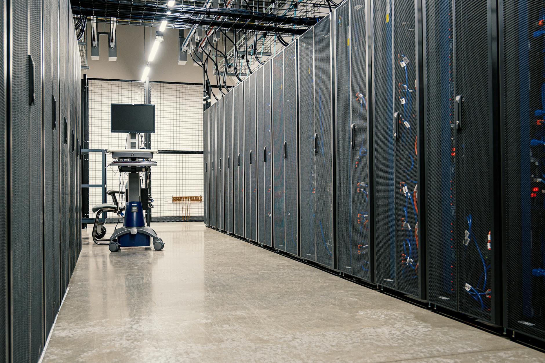 Server racks in a modern data centre — the Enterprise Compute Initiative subsidises 70% of AI cloud costs.