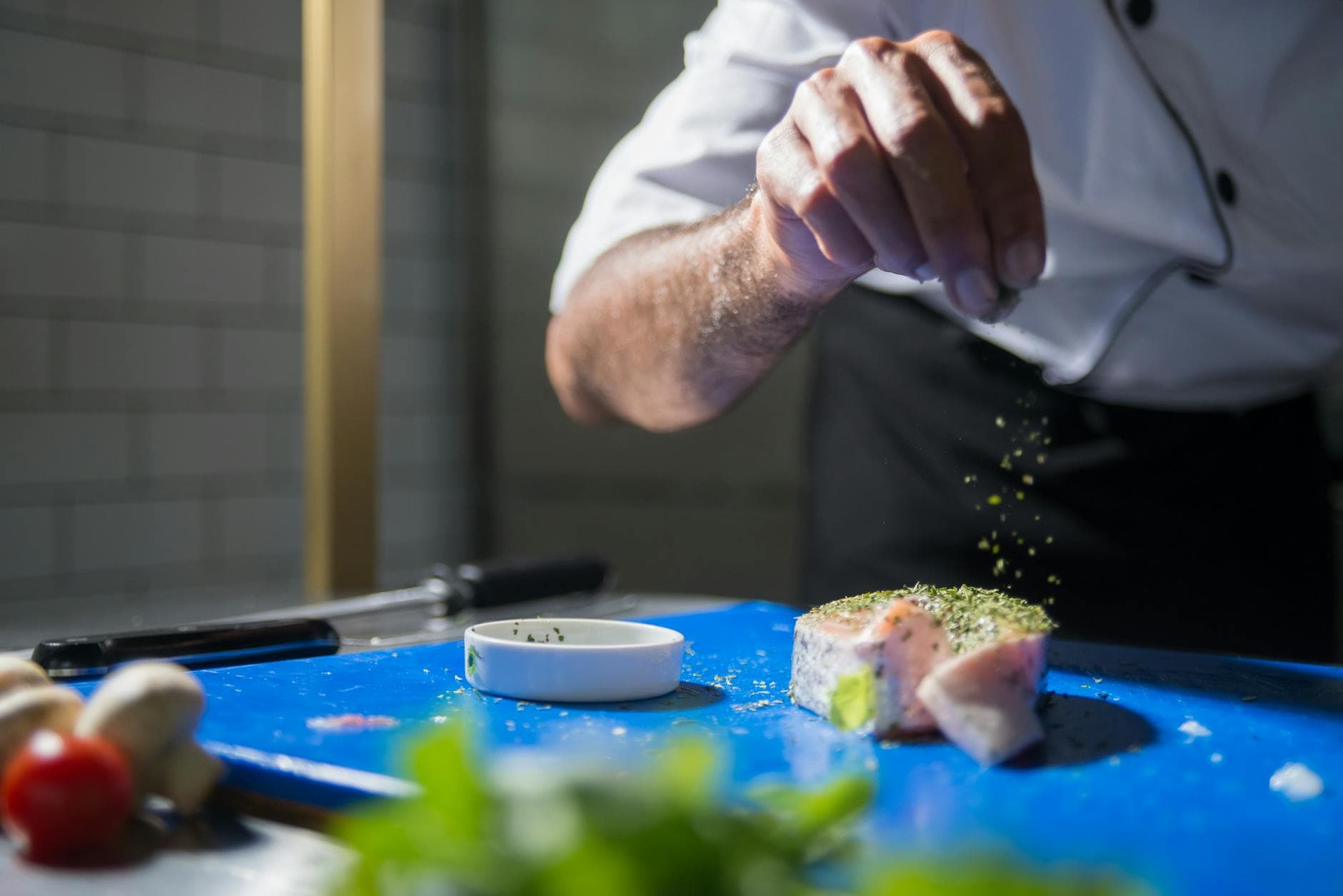 Fresh ingredients in a commercial kitchen — AI demand forecasting helps F&B operators stop wasting inventory.