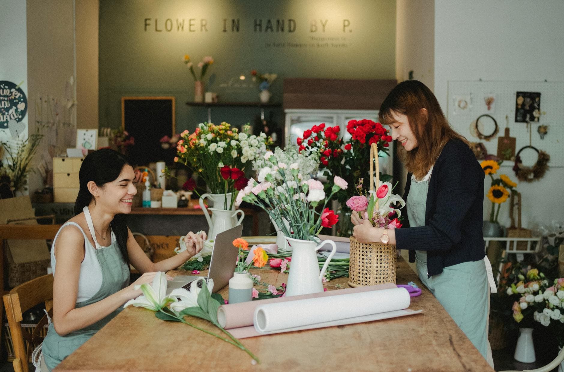 A business owner reviewing finances on a laptop — PSG and EDG reimbursements work very differently in practice.
