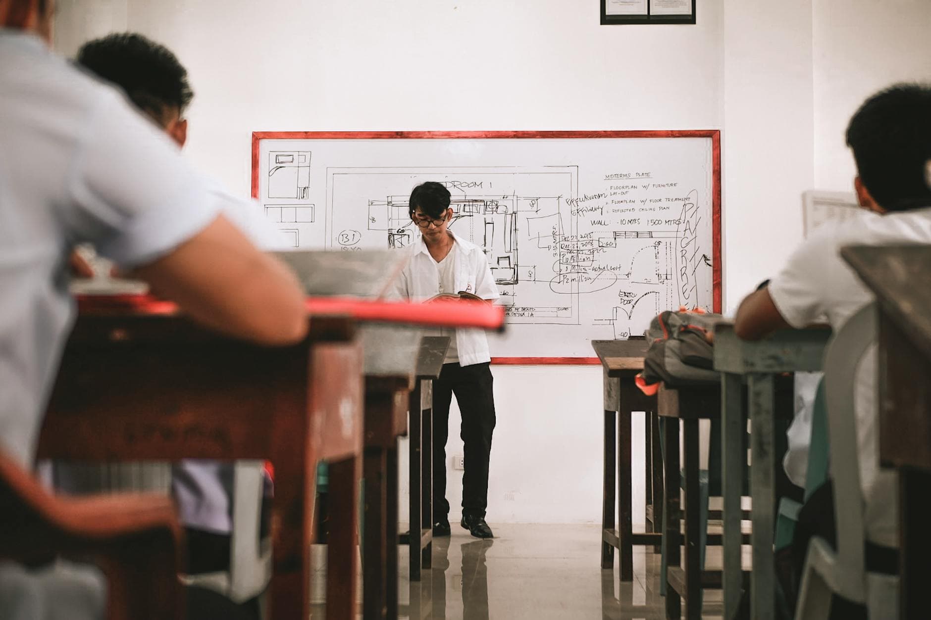 Students at a tuition centre — AI scheduling and retention tools help operators run leaner.